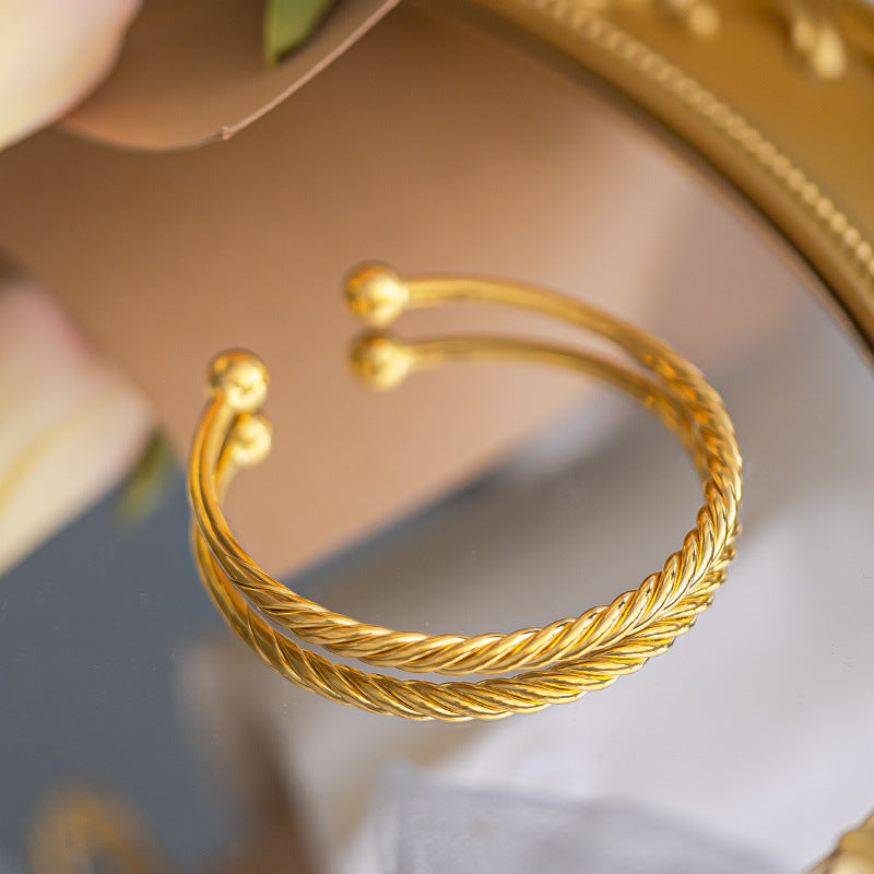 Polished Surface Twist Push-pull Alluvial Gold Bracelet
