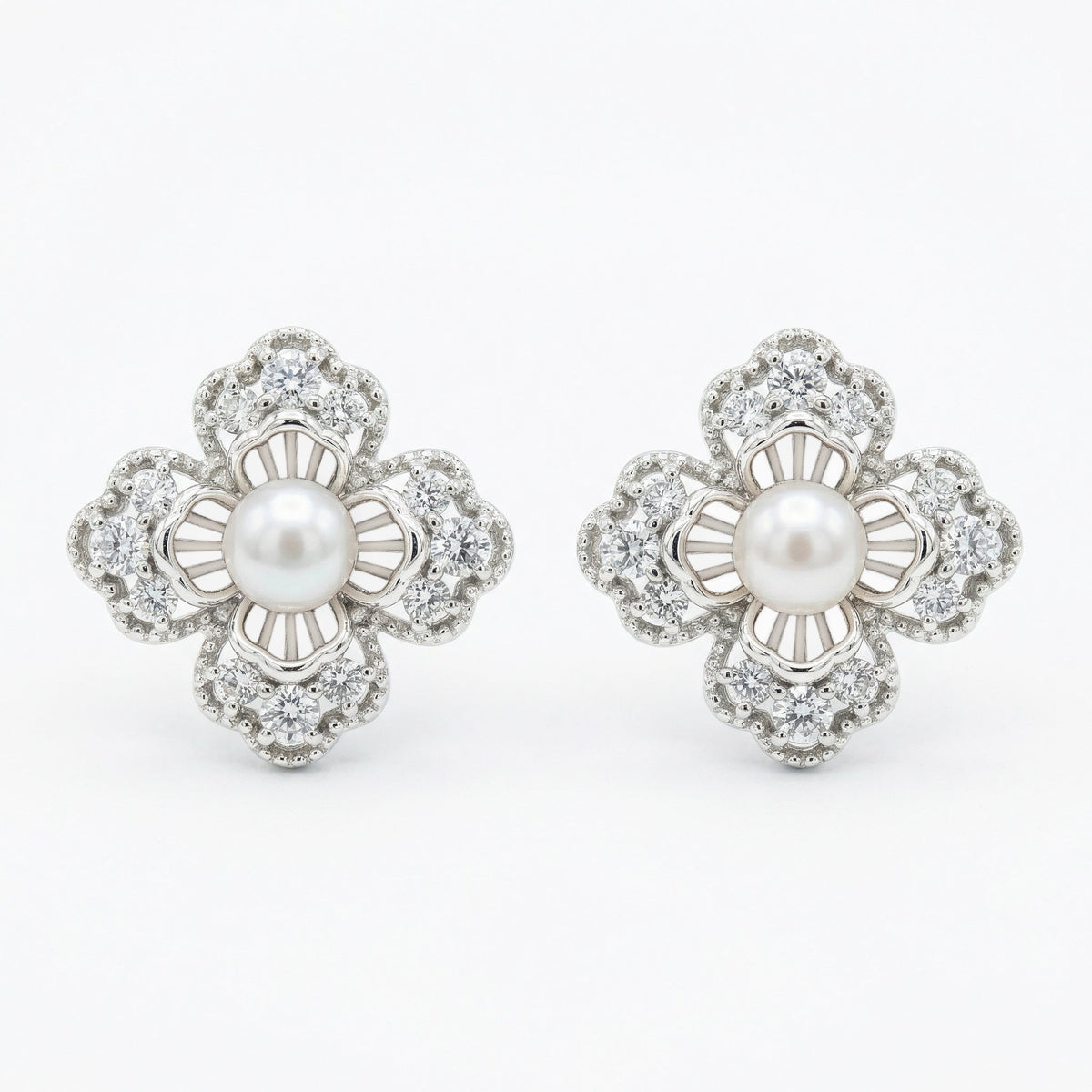925 Sterling Silver Elegant Floral Pearl and Sparkling Accent Stud Earrings in White Metal