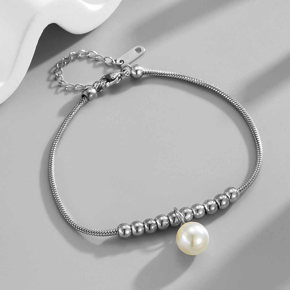 18k gold snake bone beaded anklet with a large heart-shaped heart