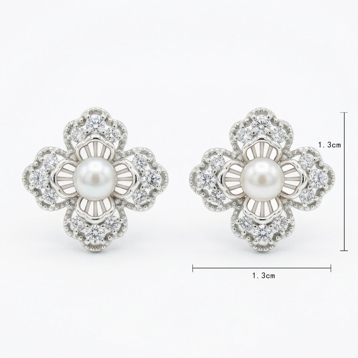 925 Sterling Silver Elegant Floral Pearl and Sparkling Accent Stud Earrings in White Metal