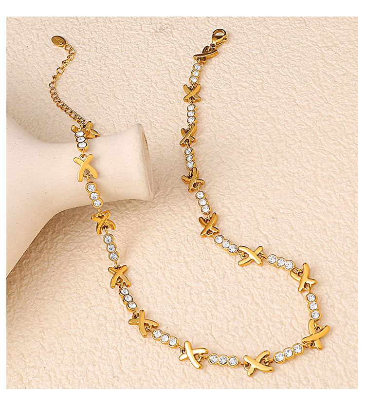 X-shaped Diamond-studded Necklace Set For Ladies - Luxurious And High-end, Featuring A Sparkling Array Of Diamonds And A Stainless Steel Bracelet Accessory.